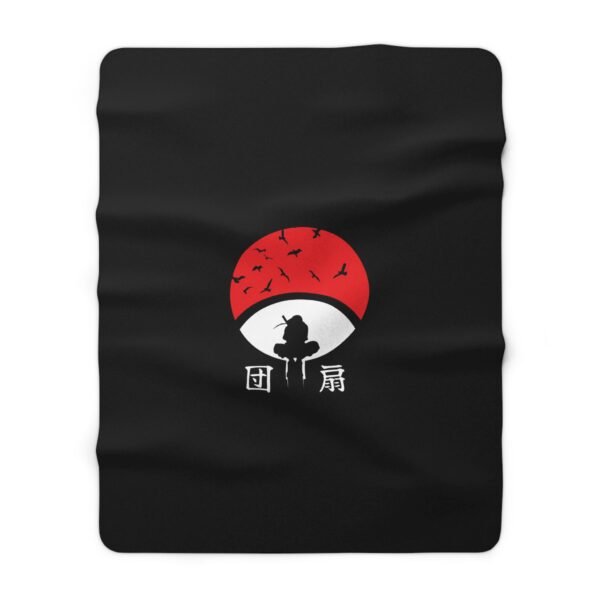 Black blanket with red sun and silhouette design.
