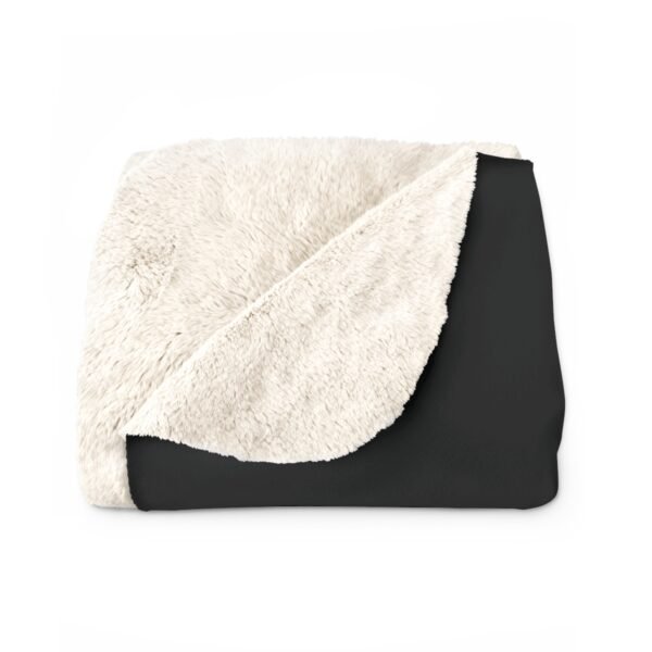 Black and white fleece throw blanket.