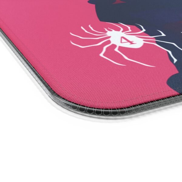 Close-up of pink mat with spider design.